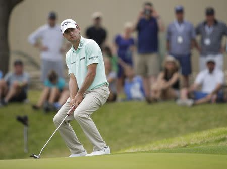 Mar 24, 2018; Austin, TX, USA; Kevin Kisner of the United States reacts to his putt on number 7 playing against Ian Poulter of England during the fifth round of the WGC - Dell Technologies Match Play golf tournament at Austin Country Club. Mandatory Credit: Erich Schlegel-USA TODAY Sports