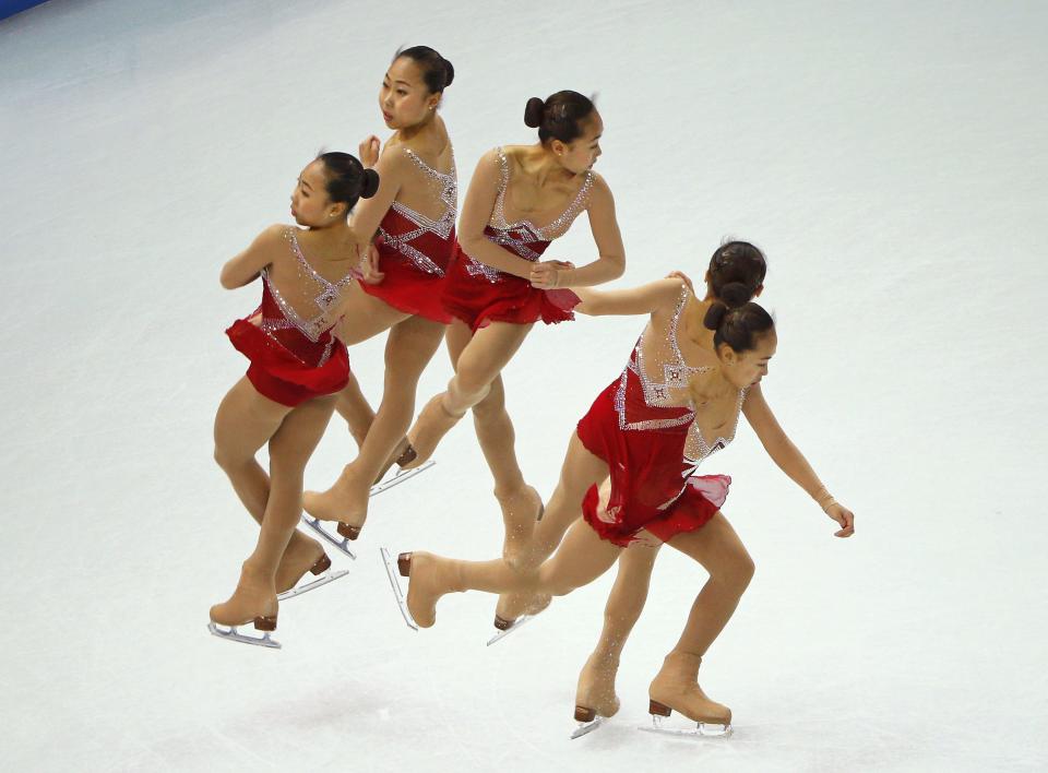 Zhang Kexin of China competes during the figure skating team ladies short program at the Sochi 2014 Winter Olympics, February 8, 2014. Picture taken with multiple exposure. REUTERS/Brian Snyder