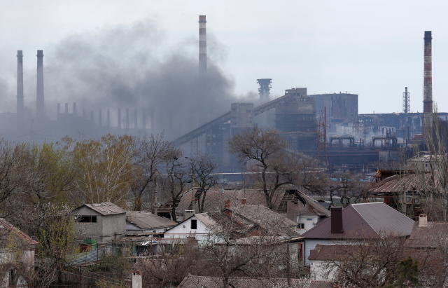 Smoke rises above the Azovstal Iron and Steel Works plant in Mariupol, Ukraine, on April 21. (Alexander Ermochenko/Reuters)