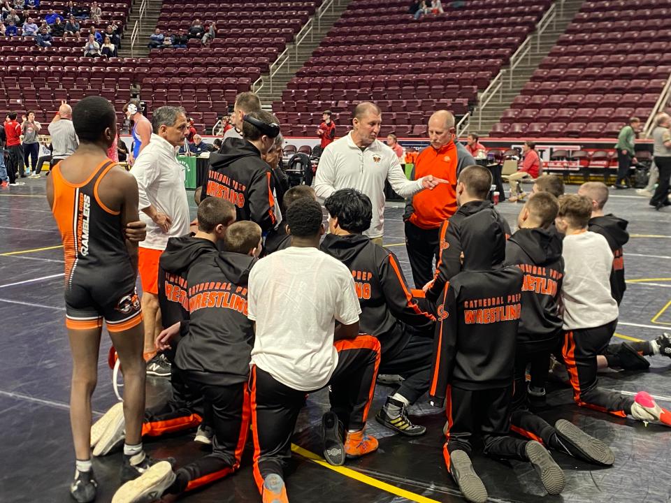 Cathedral Prep head coach Mike Hahsey (center) addresses the team at Giant Center after Thursday’s 48-13 loss to Pennridge.