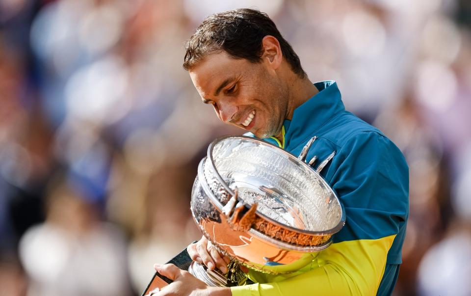 Rafa Nadal of Spain celebrates his victory with the Musketeers Cup after the men's final against Casper Ruud of Norway during the Men's Singles Final match on Day 15 of The 2022 French Open at Roland Garros on June 5, 2022 in Paris, France. - GETTY IMAGES