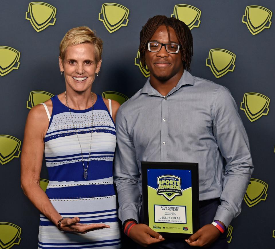 Boys Athlete of the Year Jessey Colas, Braden River High School, with 12-time Olympic medalist Dara Torres.