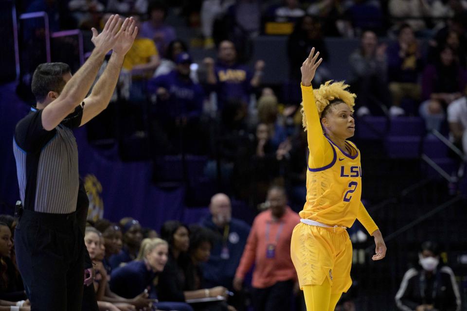 LSU guard Jasmine Carson (2) signals a three point basket in the first half of an NCAA college basketball game against Auburn, Sunday, Jan. 15, 2023, in Baton Rouge, La. (AP Photo/Matthew Hinton)