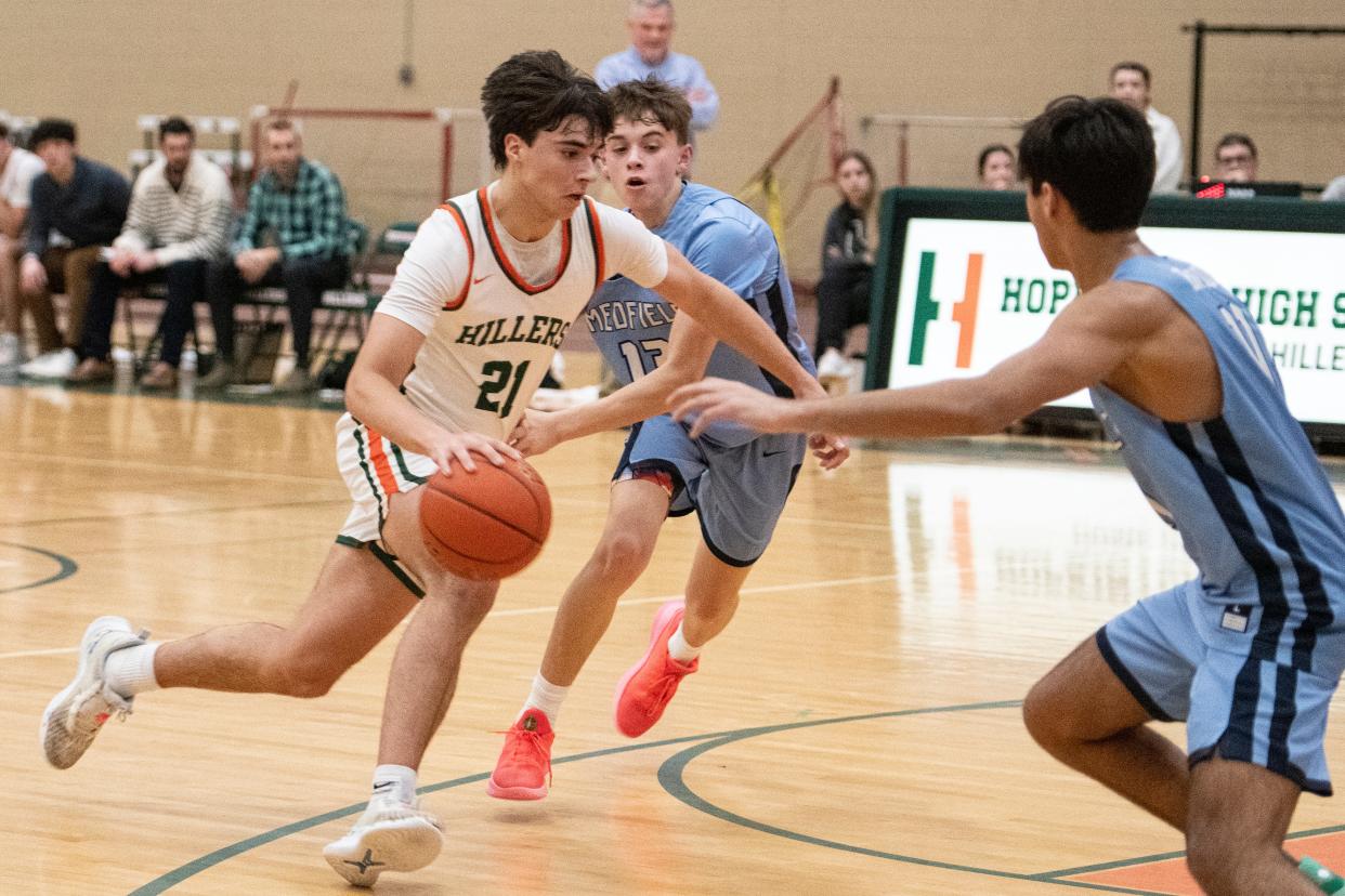 Hopkinton junior Sam Dadagian drives to the basket during the game in Hopkinton against Medfield, Feb. 6, 2024. The Hillers beat the Big Blue, 79-57.