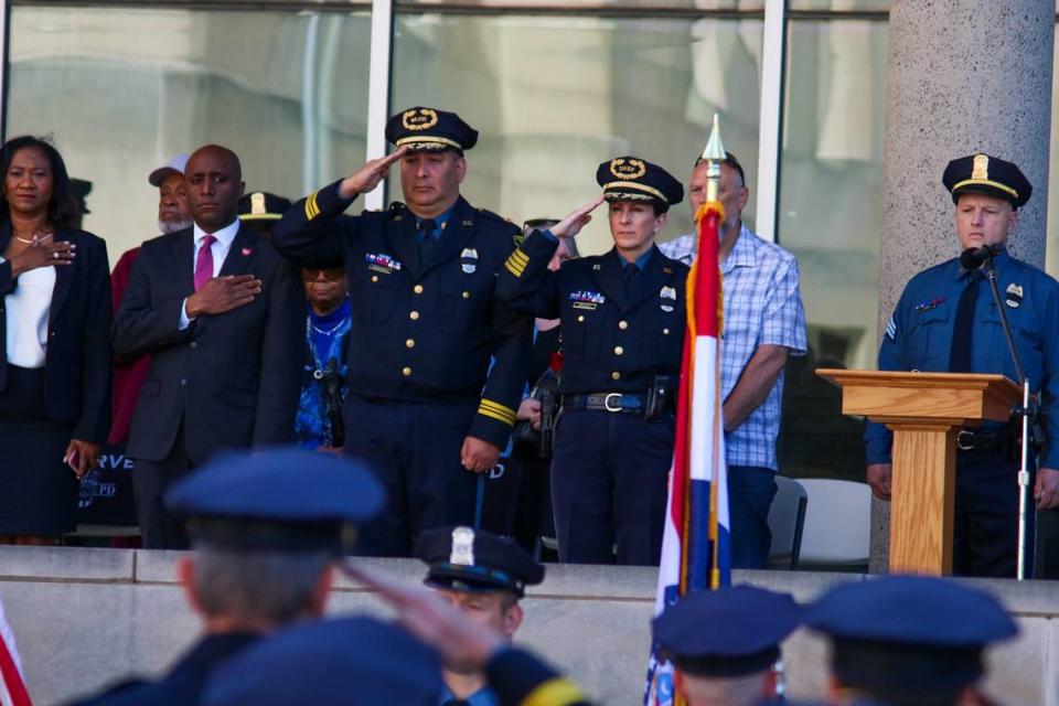 Kansas City Police Chief Stacey Graves salutes at the beginning of an annual ceremony honoring fallen KCPD officers on May 9, 2024.