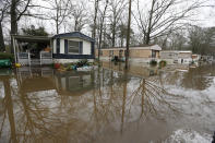 Standing floodwater from the Pearl River surrounds a number of mobile homes in the Harbor Pines community in Ridgeland, Miss., Tuesday, Feb. 18, 2020. While much of the water in the community receded overnight, there are areas that still have high water. (AP Photo/Rogelio V. Solis)