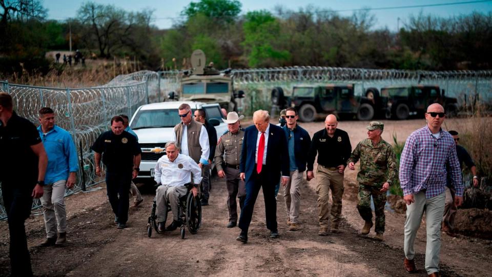 PHOTO: Donald Trump speaks with with Texas Gov. Greg Abbott during a tour of the U.S.-Mexico border at Shelby Park in Eagle Pass, Texas, Feb 29, 2024. (Jabin Botsford/The Washington Post via Getty Images)