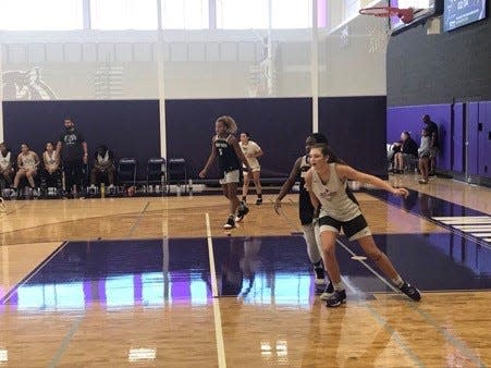 June 4, 2022: Millennium's Elli Guiney (far right) and Desert Vista's Shay Ijiwoye battle for position, and Ijiwoye's teammate Jerzy Robinson plays defense near the basket, and Guiney's teammate Mia Amundsen stands in the opposite corner during a game at the Monarch Sports Lady Extravaganza tournament at Millennium High School in Goodyear, Ariz.