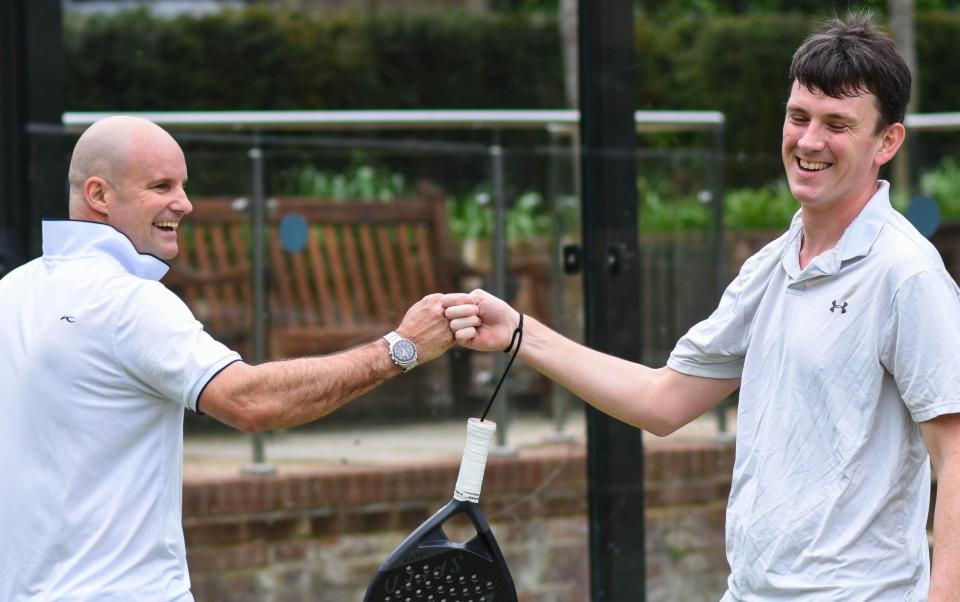 Sir Andrew Strauss and Tim Wigmore bump fists