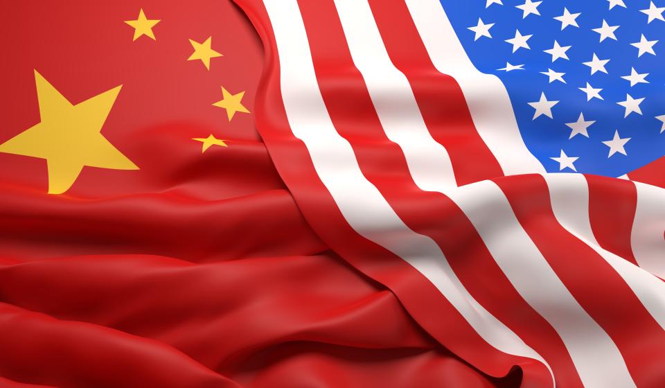 The flags of China and the USA overlapping