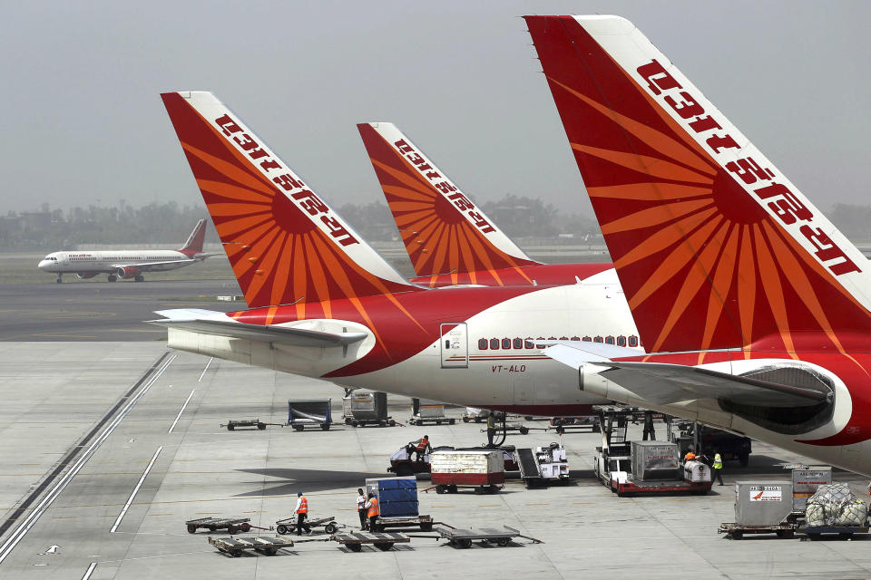 FILE - Air India aircrafts stand at Indira Gandhi International Airport in New Delhi, India, April 29, 2011.  An Air India plane flying from New Delhi to San Francisco landed in Russia after it developed an engine problem, officials said on Wednesday, June 7, 2023. The plane, carrying 216 passengers and 16 crew members, landed safely at Russia’s Magadan airport in the country’s far east on Tuesday, Air India said in a statement. (Kevin Frayer / AP file)