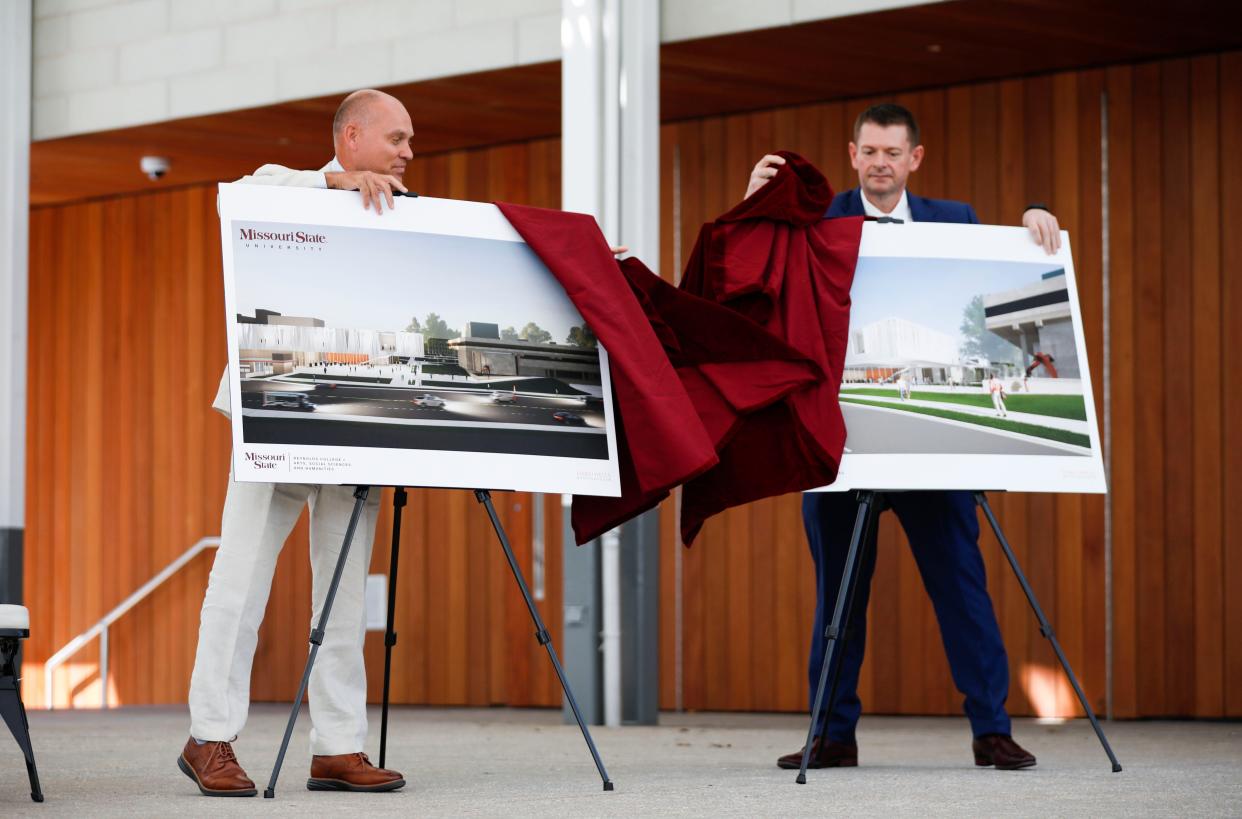Brent Dunn, vice president of university advancement and executive director of the Missouri State Foundation and Shawn Wahl, the dean of the Judith Enyeart Reynolds College of Arts, Social Sciences and Humanities unveil renderings during an announcement on the largest one-time gift in university history at the John Goodman Ampitheatre on Friday, Aug. 18, 2023.