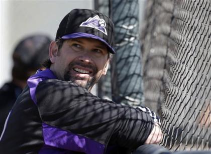 Surgery to end Todd Helton's season, plans on playing in 2013