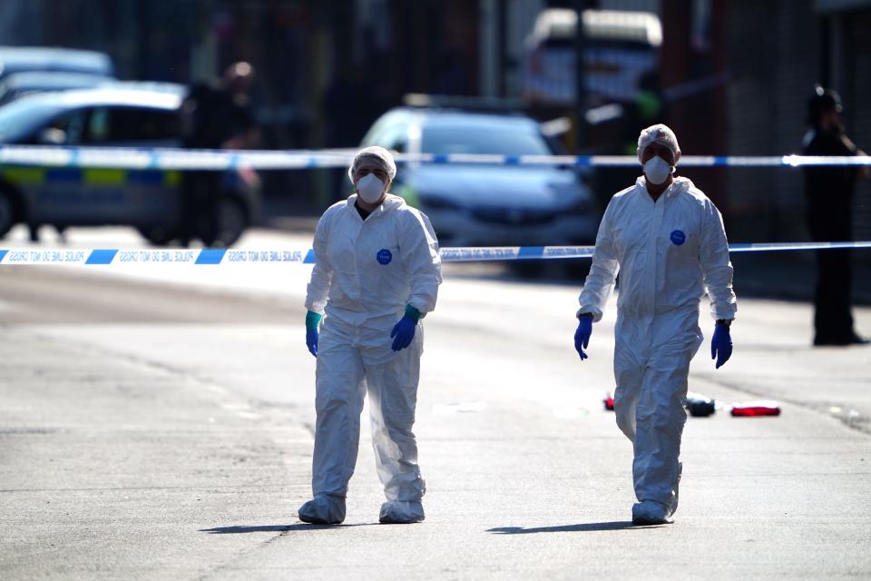 Police forensics officers on Ilkeston Road, Nottingham, as a 31-year-old man has been arrested on suspicion of murder after three people were killed in Nottingham city centre early on Tuesday morning. Picture date: Tuesday June 13, 2023.