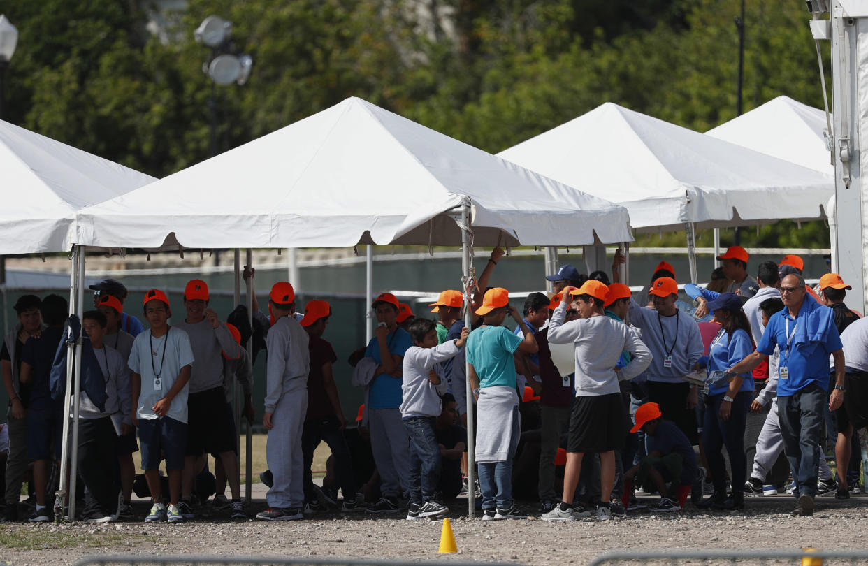 Migrant children stand outside the Homestead Temporary Shelter for Unaccompanied Children in Homestead, Florida, on May 6, 2019. (Photo: Wilfredo Lee/ASSOCIATED PRESS)