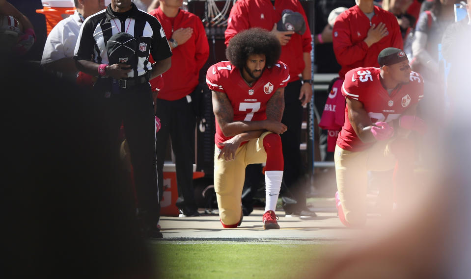 San Francisco 49ers quarterback Colin Kaepernick kneeling during the national anthem