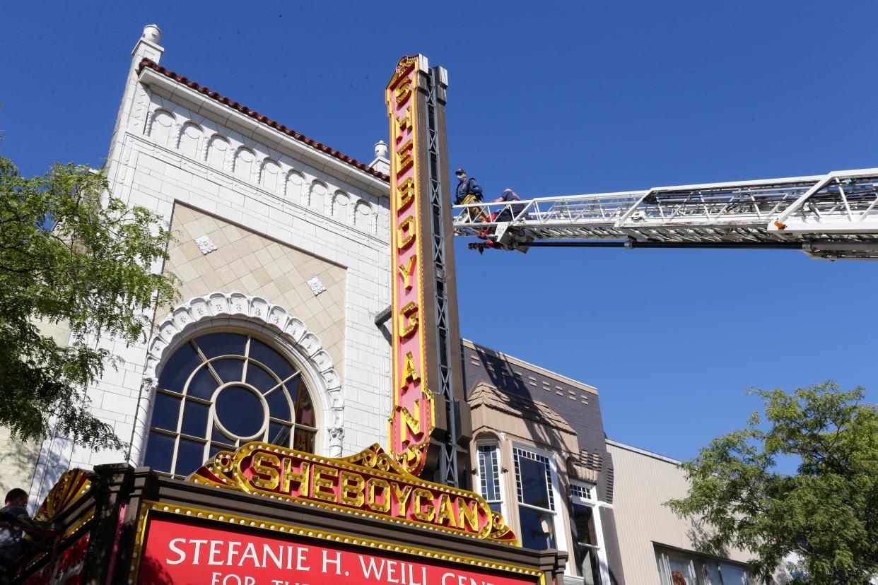 The boom of the City of Sheboygan Fire Department truck reaches out to the marquee of the Stefanie H. Weill Center for the Performing Arts, Sunday, September 23, 2018, in Sheboygan, Wis.
