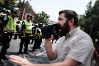 <p>KA man preaches as supporters for and against a Fort Sanders Confederate memorial monument face off in on Aug. 26, 2017 in Knoxville, Tenn. (Photo: Spencer Platt/Getty Images) </p>