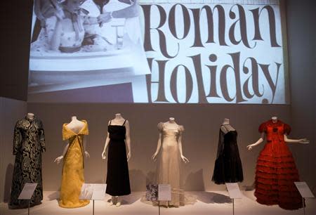 Dresses worn in films are seen displayed during a media preview of the "The Glamour of Italian Fashion 1945-2014" exhibition, at the Victoria and Albert Museum in London April 2, 2014. REUTERS/Neil Hall