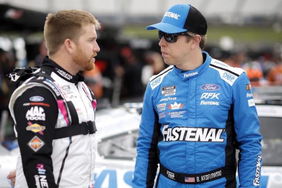 MARTINSVILLE, VIRGINIA - APRIL 15: Brad Keselowski, driver of the #6 Fastenal Ford, (R) and Chris Buescher, driver of the #17 Nexletol Ford, talk on the grid during practice for the NASCAR Cup Series NOCO 400 at Martinsville Speedway on April 15, 2023 in Martinsville, Virginia. (Photo by Sean Gardner/Getty Images)