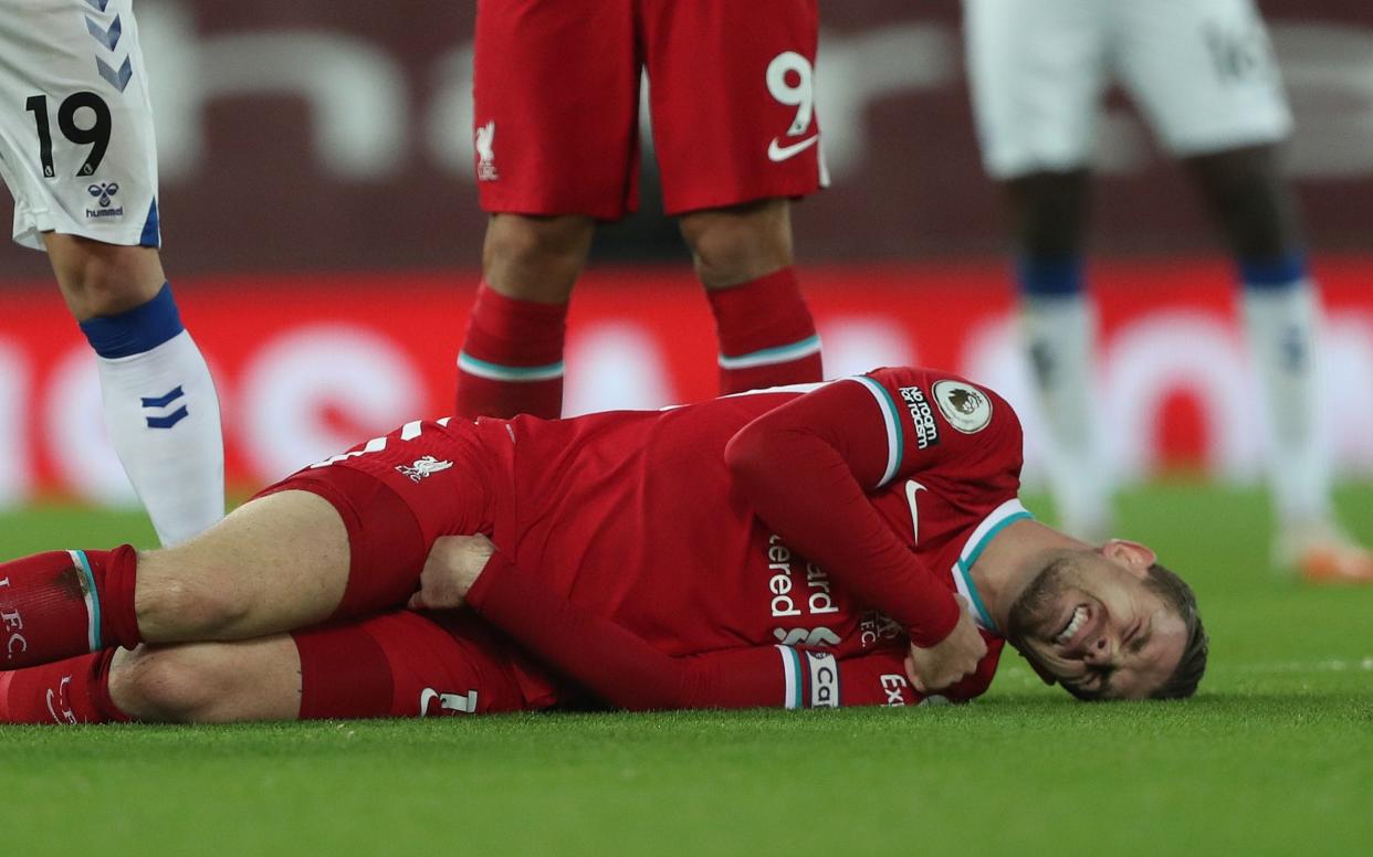 Jordan Henderson goes down injured against Everton - BRADLEY ORMESHER