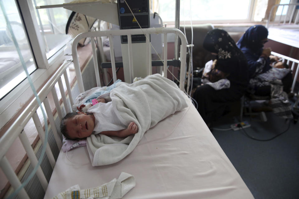 Newborn babies are cred for at the Ataturk Children's Hospital a day after they were rescued following a deadly attack on another maternity hospital, in Kabul, Afghanistan, Wednesday, May 13, 2020. Militants stormed the Barchi National Maternity Hospital in the western part of Kabul on Tuesday, setting off an hours-long shootout with the police and killing tens of people, including two newborn babies, their mothers and an unspecified number of nurses, Afghan officials said. (AP Photo/Rahmat Gul)