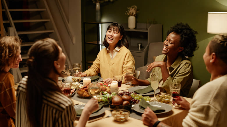 Dinner party guests at table