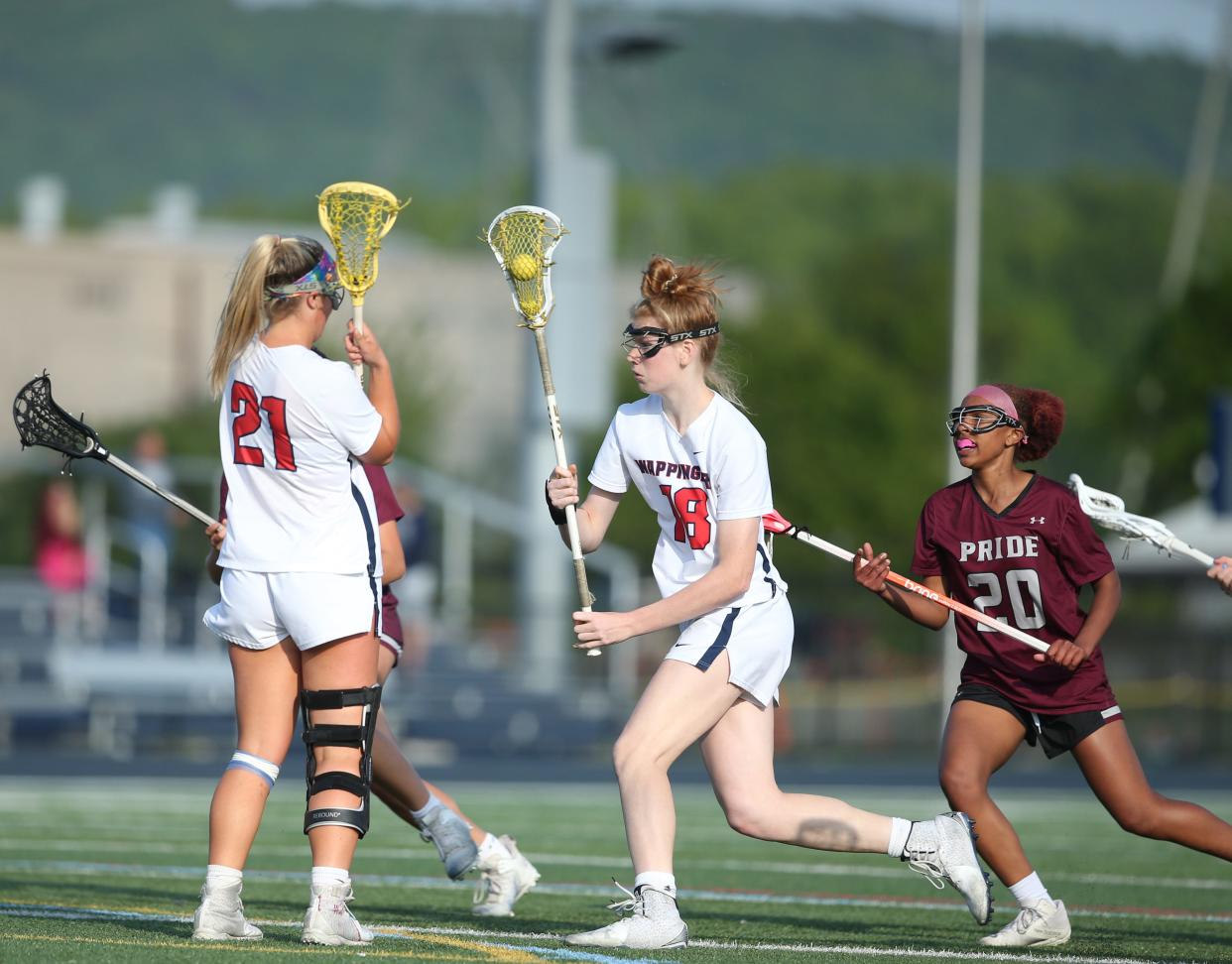 Wappingers' Mackenzie Velsmid drives up field after securing a draw against Ossining during a Section 1 Class A girls lacrosse quarterfinal on May 19, 2023.
