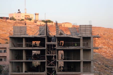 Israeli forces began preparations to demolish homes near a military barrier on the outskirts of Jerusalem