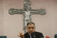 Cardinal Angelo Becciu talks to journalists during press conference in Rome, Friday, Sept. 25, 2020. The powerful head of the Vatican's saint-making office, Cardinal Angelo Becciu, has resigned from the post and renounced his rights as a cardinal amid a financial scandal that has reportedly implicated him indirectly. (AP Photo/Gregorio Borgia)