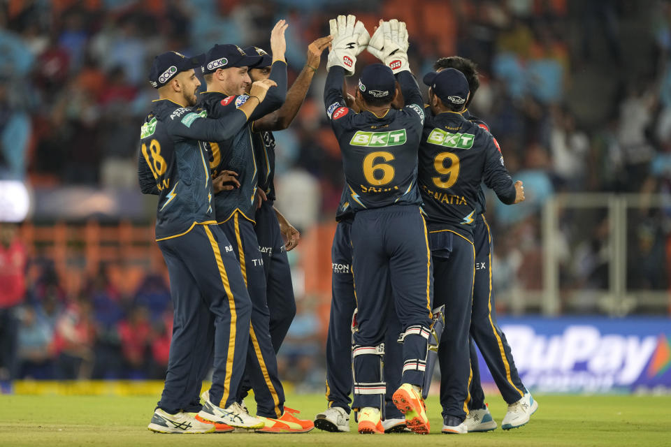 Gujarat Titans players celebrate the dismissal of Delhi Capitals' Rilee Rossouw during the Indian Premier League cricket match between Gujarat Titans and Delhi Capitals in Ahmedabad, India, Tuesday, May 2, 2023. (AP Photo/Ajit Solanki)