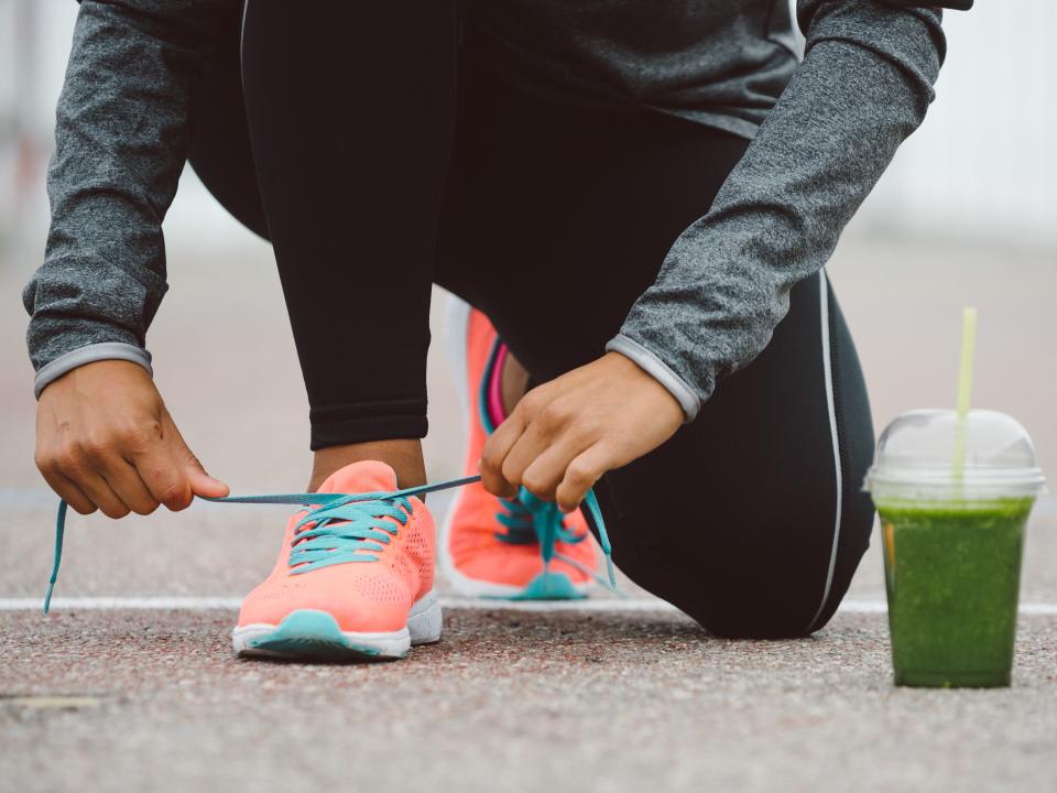 tying shoes fitness weight loss run jog green juice