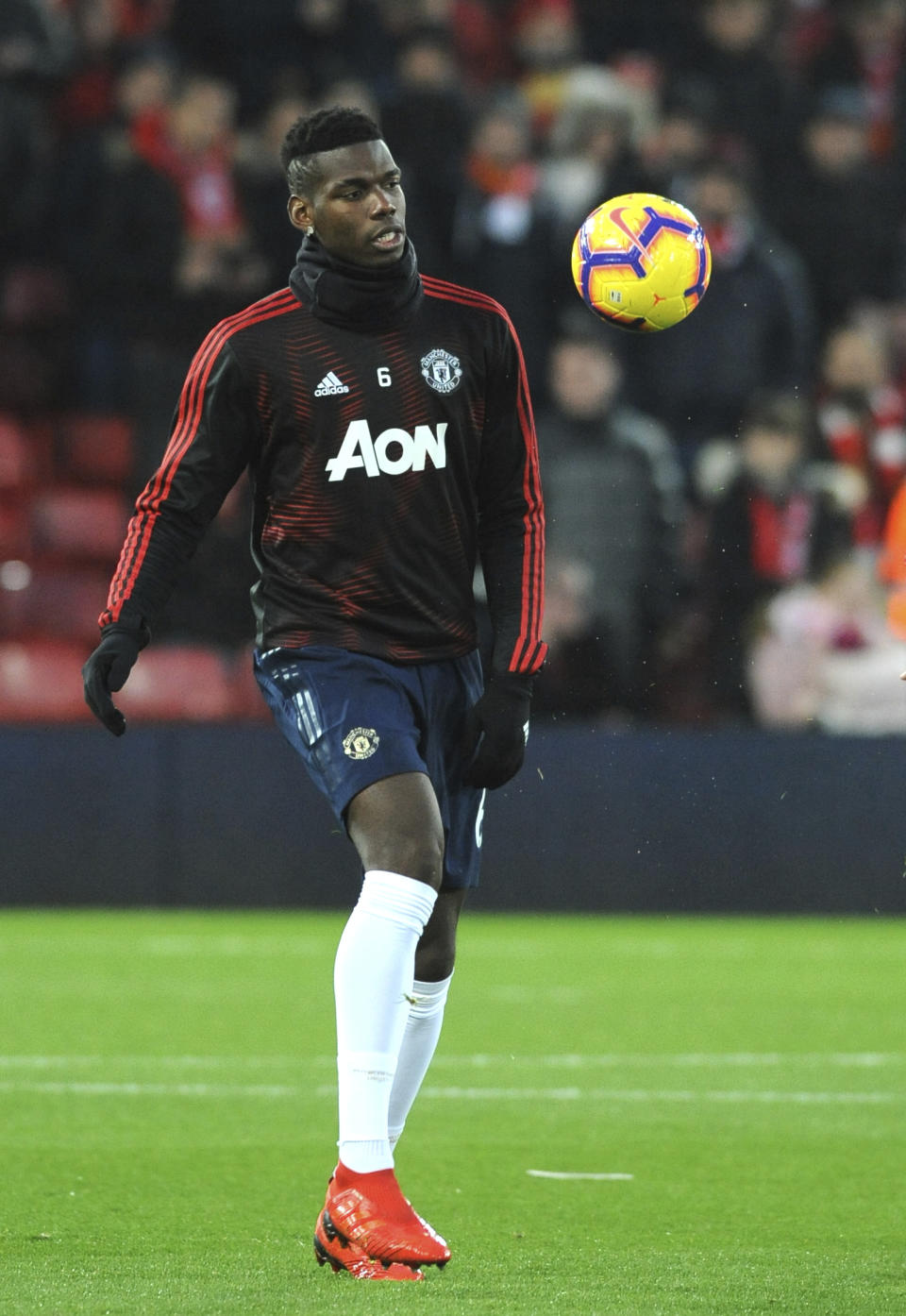 Manchester United's Paul Pogba warms up prior to the English Premier League soccer match between Liverpool and Manchester United at Anfield in Liverpool, England, Sunday, Dec. 16, 2018. (AP Photo/Rui Vieira)