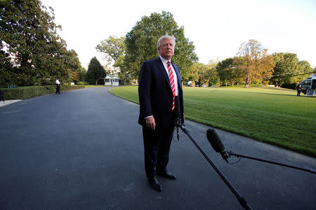 U.S. President Donald Trump talks to the media on South Lawn of the White House in Washington before his departure to Greensboro, North Carolina, U.S., October 7, 2017. REUTERS/Yuri Gripas