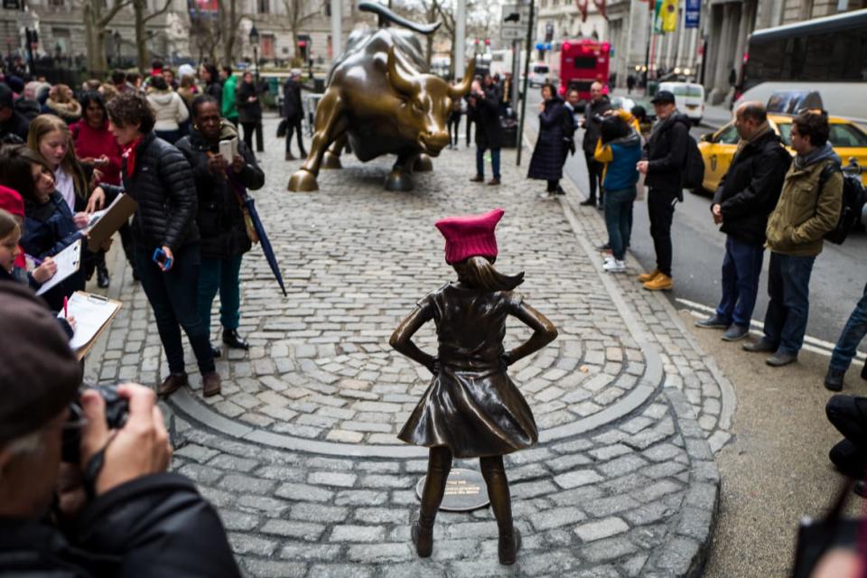 <div class="inline-image__caption"><p><em>Fearless Girl</em>'s original location was across from the famed Charging Bull statue.</p></div> <div class="inline-image__credit">Drew Angerer/Getty Images</div>