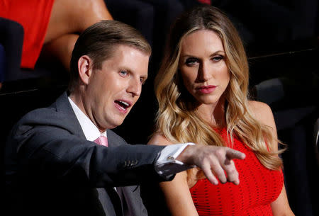 FILE PHOTO - Donald Trump's son Eric Trump and his wife Lara Yunaska watch the proceedings during the third day of the Republican National Convention in Cleveland, Ohio, U.S., July 20, 2016. REUTERS/Carlo Allegri/File Photo