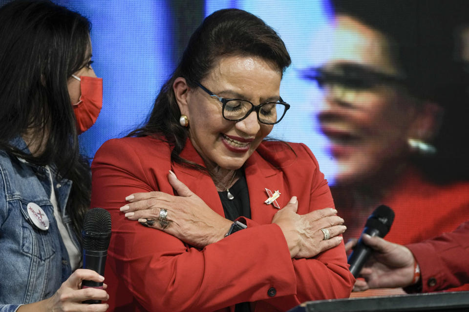 Free Party presidential candidate Xiomara Castro acknowledges her supporters after general elections, in Tegucigalpa, Honduras, Sunday, Nov. 28, 2021. Castro claimed victory, setting up a showdown with the National Party which said its candidate had won a vote that could end the conservative party's 12 years in power. (AP Photo/Moises Castillo)