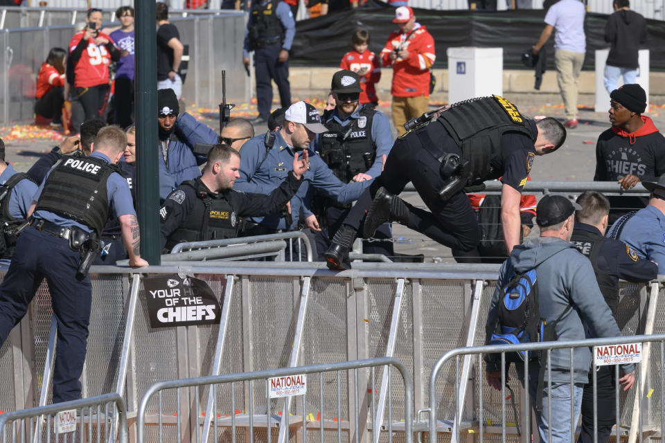 FILE - Law enforcement personnel clear the area around Union Station following a shooting at the Kansas City Chiefs NFL football Super Bowl celebration in Kansas City, Mo., Wednesday, Feb. 14, 2024. Missouri prosecutors said Tuesday, Feb. 20, that two men have been charged with murder in last week’s shooting that killed one person and injured multiple others after the Kansas City Chiefs’ Super Bowl parade. (AP Photo/Reed Hoffmann, File)