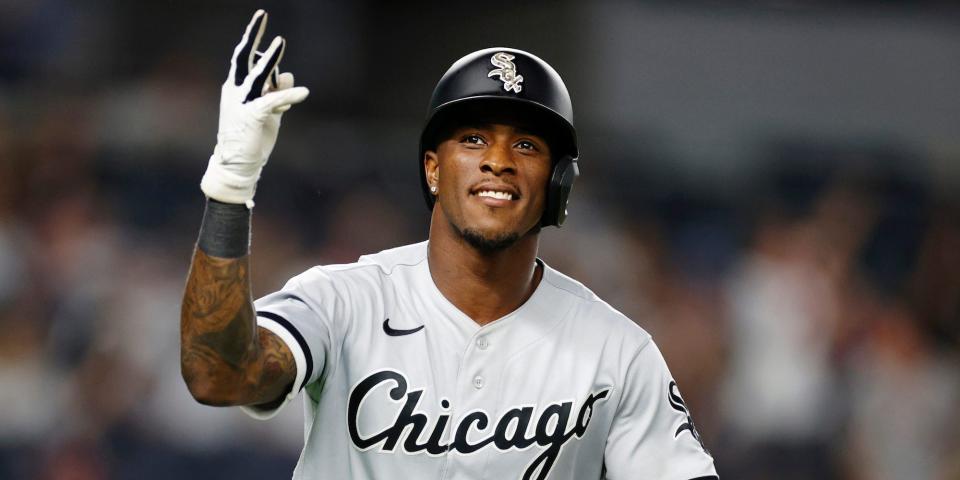 Tim Anderson smiles as he tosses his bat during a game in May 2022.