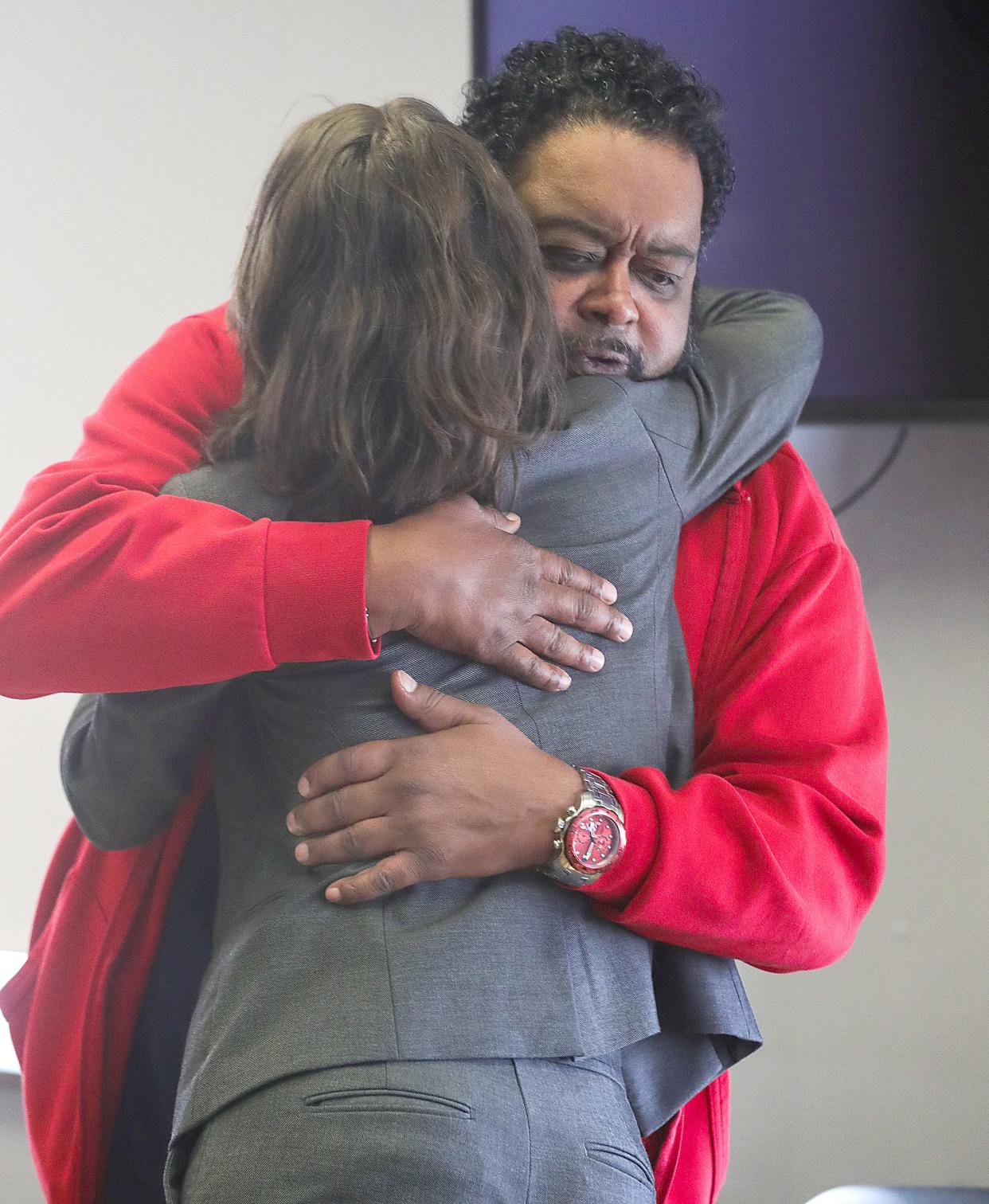 Activist Jacob Blake Sr. of North Carolina hugs his defense attorney Elizabeth Bonham after a jury was unable to deliver a verdict on Tuesday, March 28, 2023, in Akron, Ohio. Visiting Judge Ralph Perk declared a mistrial.