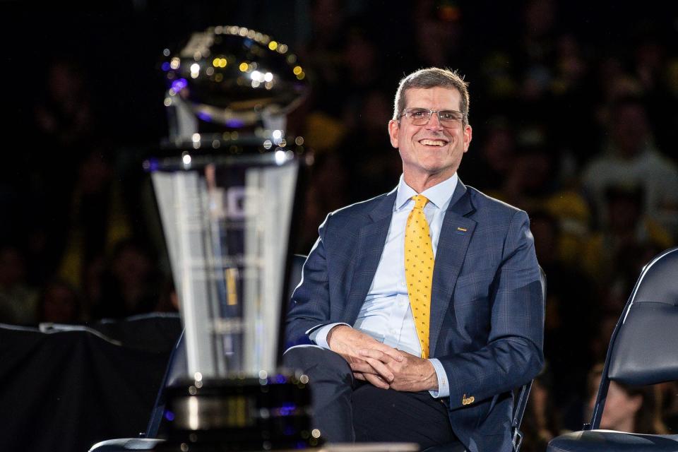 Jim Harbaugh looks on during Michigan's national championship celebration.