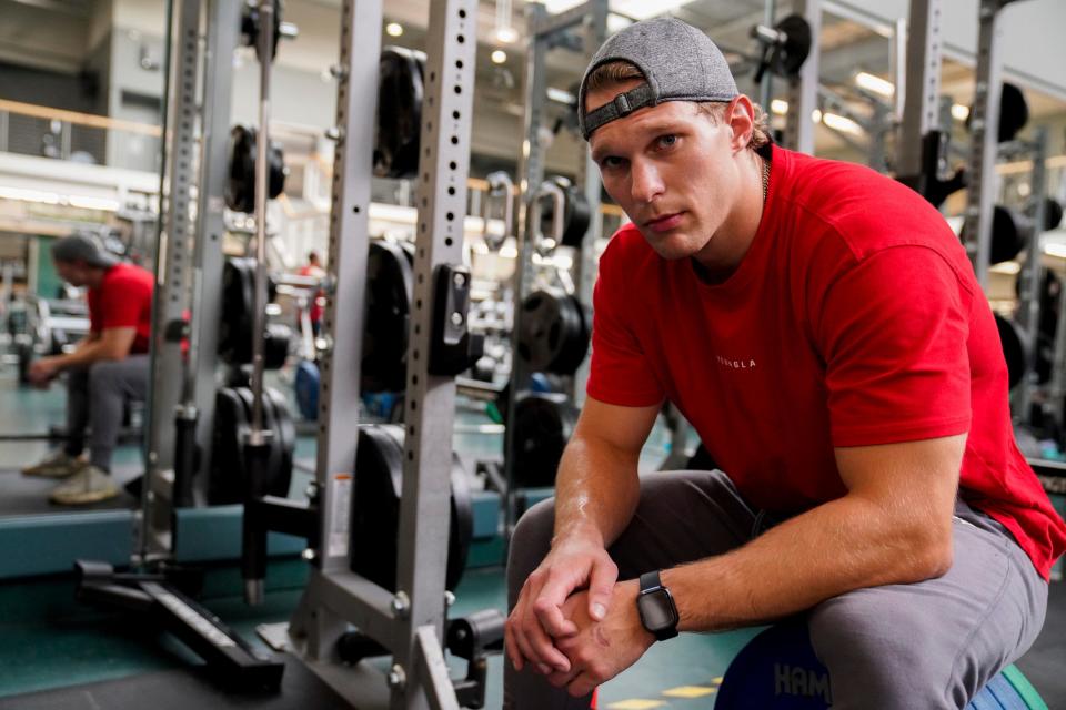 Tommy Hojnicki, 23, of East Lansing, at Michigan State University's IM West recreational facility in East Lansing on Thursday, Aug. 17, 2023. Hojnicki joined his local gym in sixth grade, after finding out his father's stroke could have been prevented with exercise. Now, going to the gym six times a week, Hojnicki said it's difficult to maintain positive self-image. "It's always, 'I look good today,' rather than 'I look good in general,' " Hojnicki said when talking about his self-talk. "There's always critiquing."