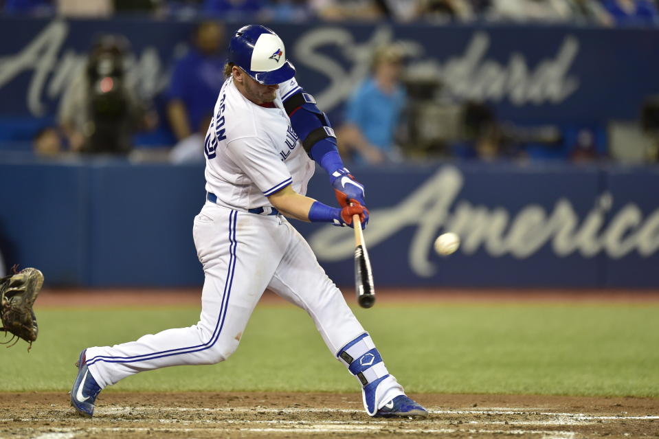 FILE - In this May 22, 2018, file photo, Toronto Blue Jays' Josh Donaldson hits a double against Los Angeles Angels starting pitcher Garrett Richards during the fifth inning of a baseball game in Toronto. The Cleveland Indians have acquired former AL MVP Donaldson in a trade with the Blue Jays. (Frank Gunn/The Canadian Press via AP, File)