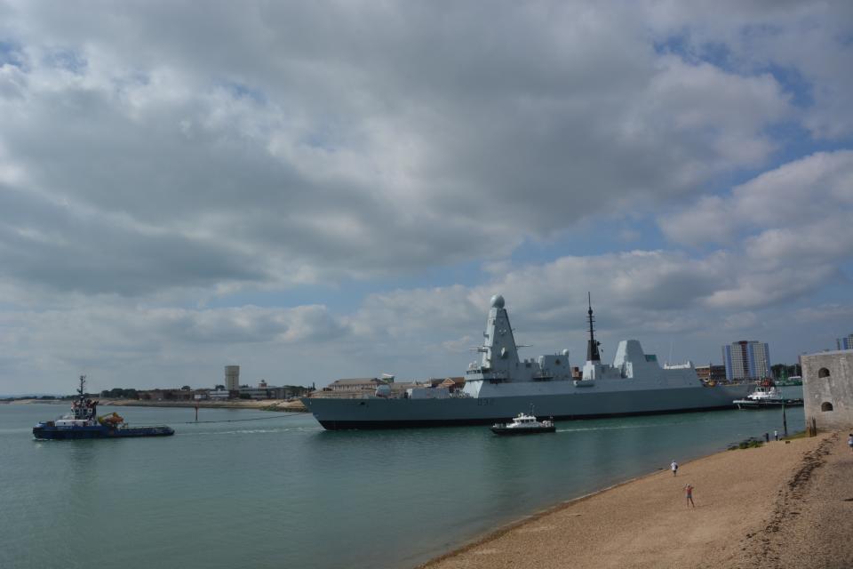 HMS Daring being towed from Portsmouth Naval Base for the multi-million pound engine refit (Ben Mitchell/PA)