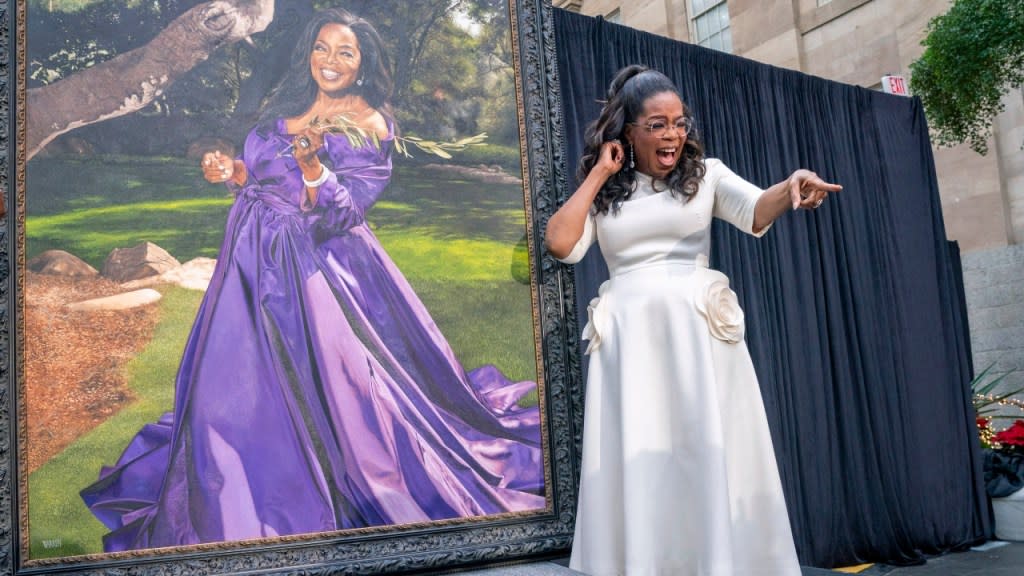 Oprah Winfrey shouts out to a member of the crowd while next to her portrait during a portrait unveiling ceremony at the Smithsonian’s National Portrait Gallery in Washington on Wednesday. (Photo: Jacquelyn Martin/AP)