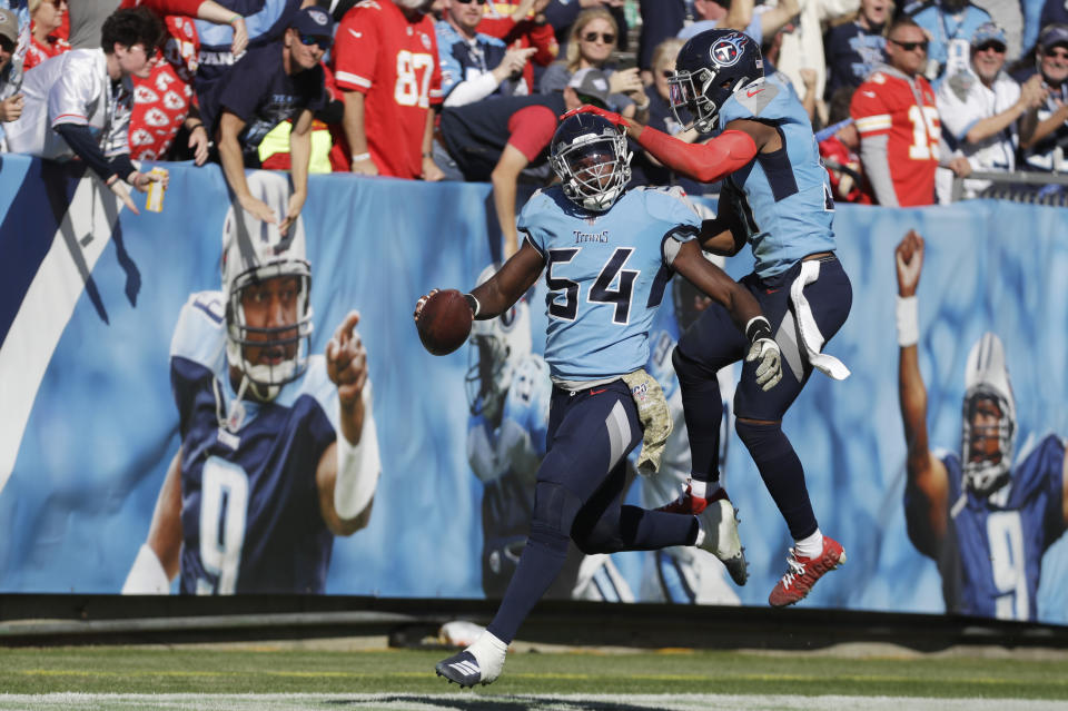 Tennessee Titans inside linebacker Rashaan Evans (54) celebrates with Kevin Byard (31) after Evans ran back a fumble 53 yards for a touchdown against the Kansas City Chiefs in the first half of an NFL football game Sunday, Nov. 10, 2019, in Nashville, Tenn. (AP Photo/James Kenney)