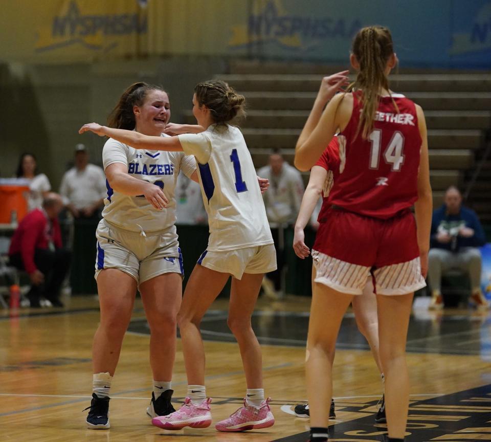 Millbrook's Ella Wilson (22) and Hudson Heitmann (1) celebrate their 59-45 win over Randolph in the girls NYSPHSAA Class C championship game at Hudson Valley Community College in Troy, on Sunday, March 19, 2023.