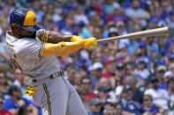 Milwaukee Brewers' Andrew McCutchen hits a two-run home run against the Chicago Cubs during the first inning of a baseball game in Chicago, Friday, Aug. 19, 2022. (AP Photo/Nam Y. Huh)