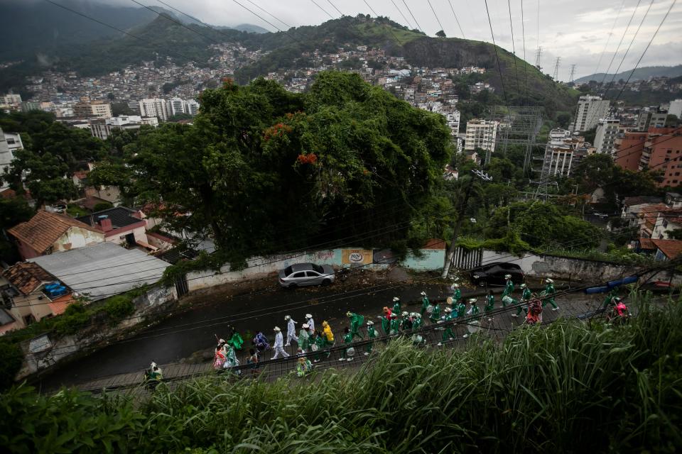 Bright Star of Bethlehem troupe members parade during The Three Kings Day celebrations in the Morro da Formiga slum of Rio de Janeiro, Brazil, Thursday, Jan. 6, 2022. The Epiphany, celebrated annually on Jan. 6,  marks the Biblical journey of The Three Kings; Gaspar, Melchior and Balthasar, to visit baby Jesus.