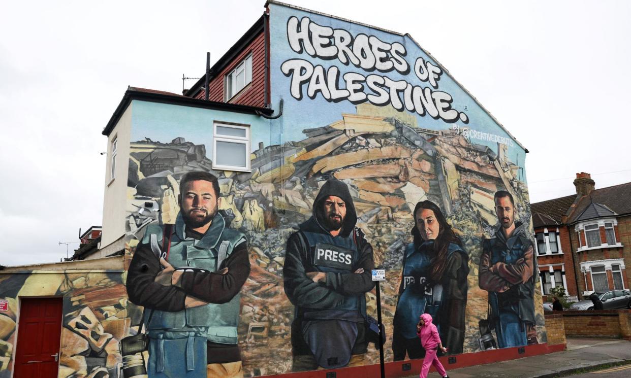 <span>The ‘Heroes of Palestine’ mural in Redbridge, east London, celebrating four Palestinian journalists.</span><span>Photograph: Daniel Leal/AFP/Getty Images</span>